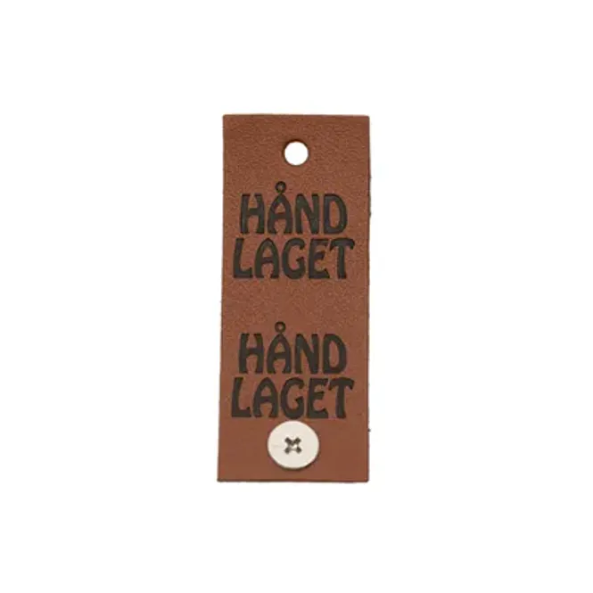 Hovedbilde Håndlaget - merke med knapp